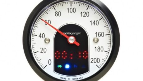 Front view of the face of the Motogadget Motoscope Tiny Gauge with black bezel.